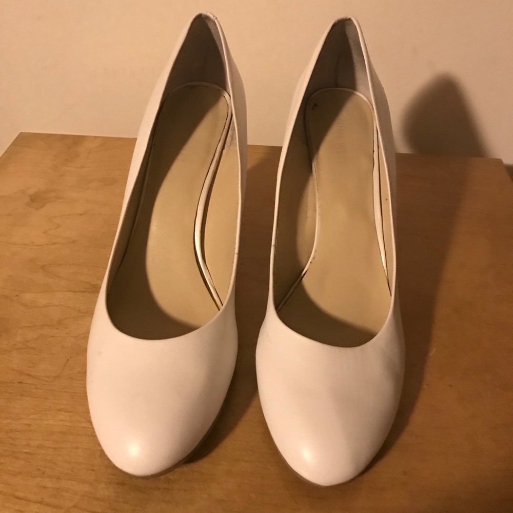 White leather pumps